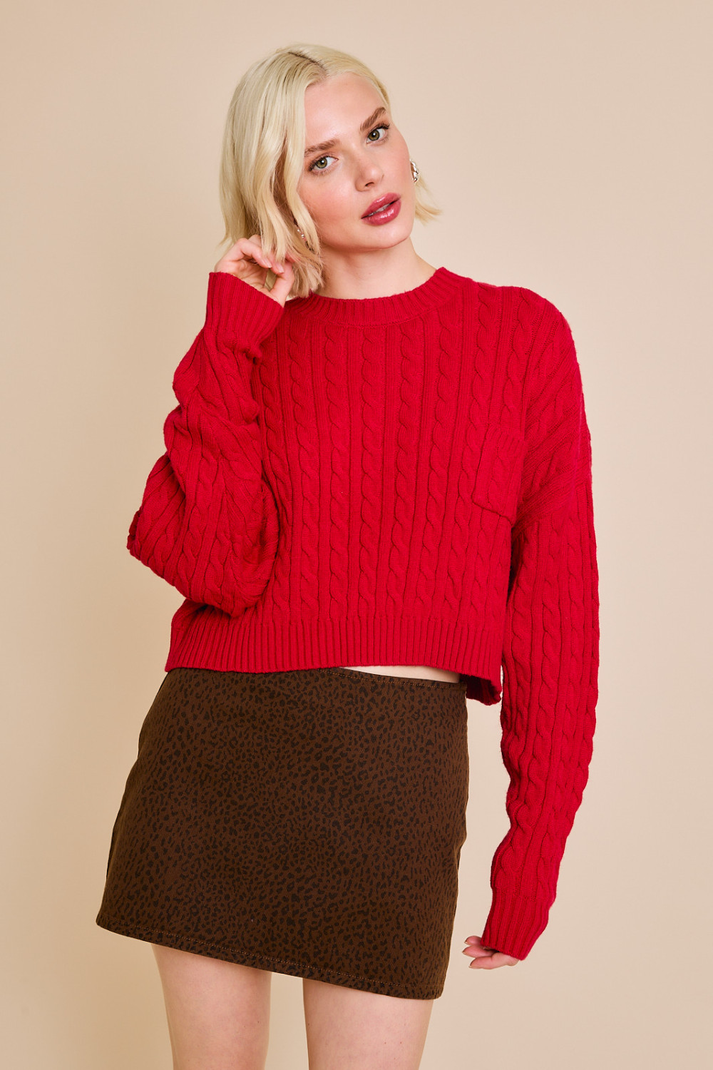 Red RARA Boutique Dolman sleeve cable knit cropped sweater with front pocket, stylish and cozy for casual wear.