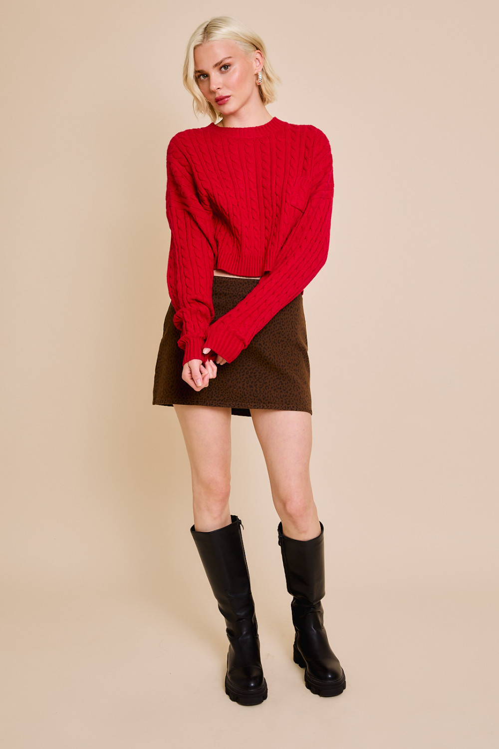 Red cable knit cropped sweater with dolman sleeves and front pocket, by RARA Boutique.