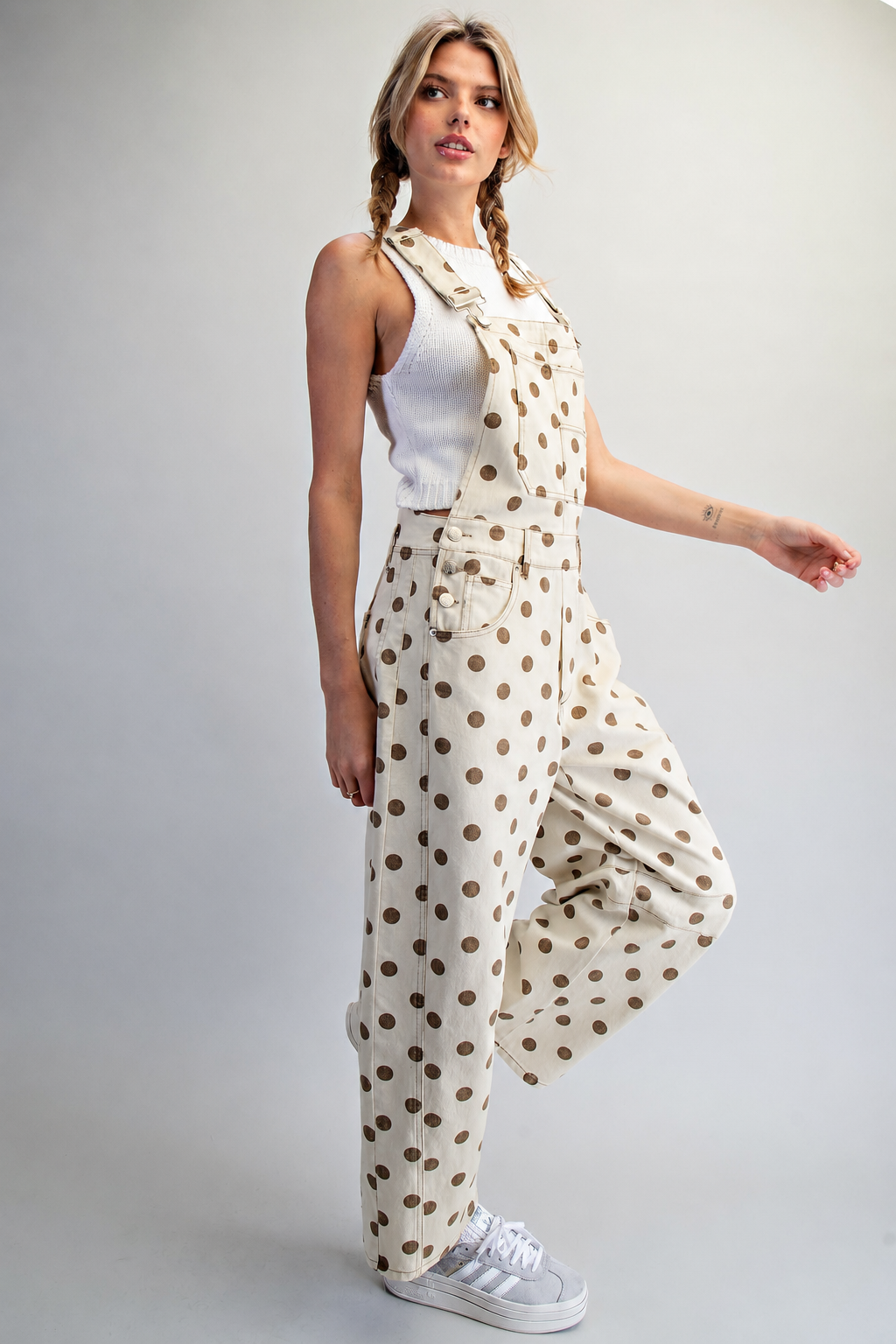 RARA Boutique polka dot denim overalls with barrel legs and mineral wash, featuring adjustable straps and side pockets.