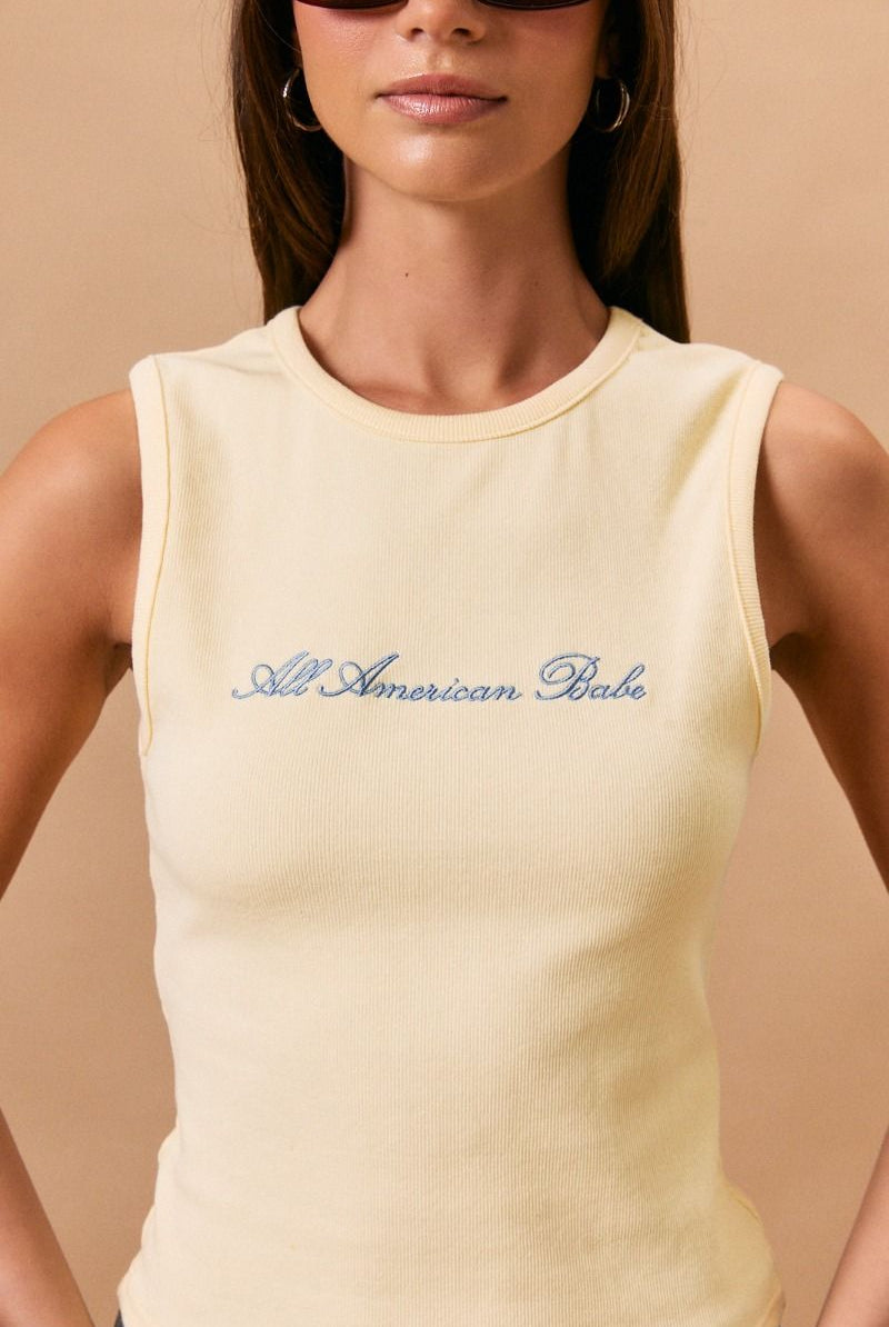 Yellow embroidered All American Babe tank top by RARA Boutique, featuring patriotic design and casual sleeveless style.