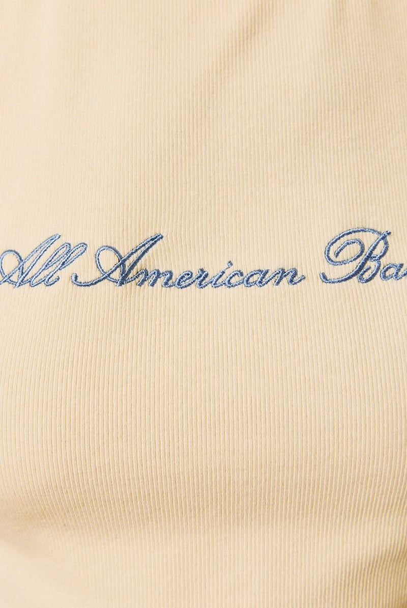 Yellow embroidered All American Babe tank top from Le Lis by RARA Boutique, featuring patriotic star and stripe details.
