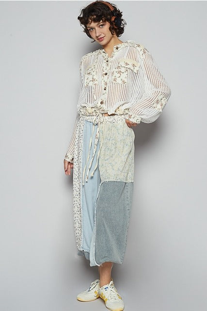 RARA Boutique floral patch open knit crochet hoodie jacket with colorful floral embroidery and relaxed fit.