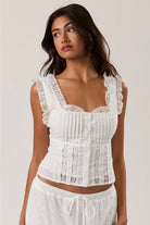 RARA Boutique sleeveless square neck blouse with eyelet lace trim, lightweight fabric, and stylish design.
