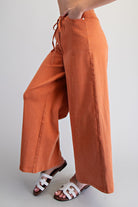 Wide leg slouchy denim pants with drawstring waist from RARA Boutique, featuring relaxed fit and casual style.