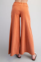 Wide leg slouchy denim pants with drawstring waist from RARA Boutique, featuring a relaxed fit and casual style.