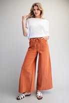 Wide leg slouchy denim pants with drawstring waist by RARA Boutique, featuring relaxed fit and casual style.