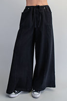 RARA Boutique wide leg slouchy denim pants with drawstring waist, relaxed fit and casual style, front view.