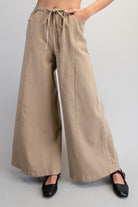RARA Boutique wide leg slouchy denim pants with drawstring waist, relaxed fit and casual style, shown in natural fabric detail.