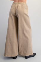 Wide leg slouchy denim pants with drawstring waist from RARA Boutique, featuring relaxed fit and casual style.