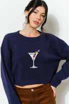 KAINA Martini Sweater by Pretty Garbage featuring a cozy knit design in a neutral color, displayed on a mannequin.