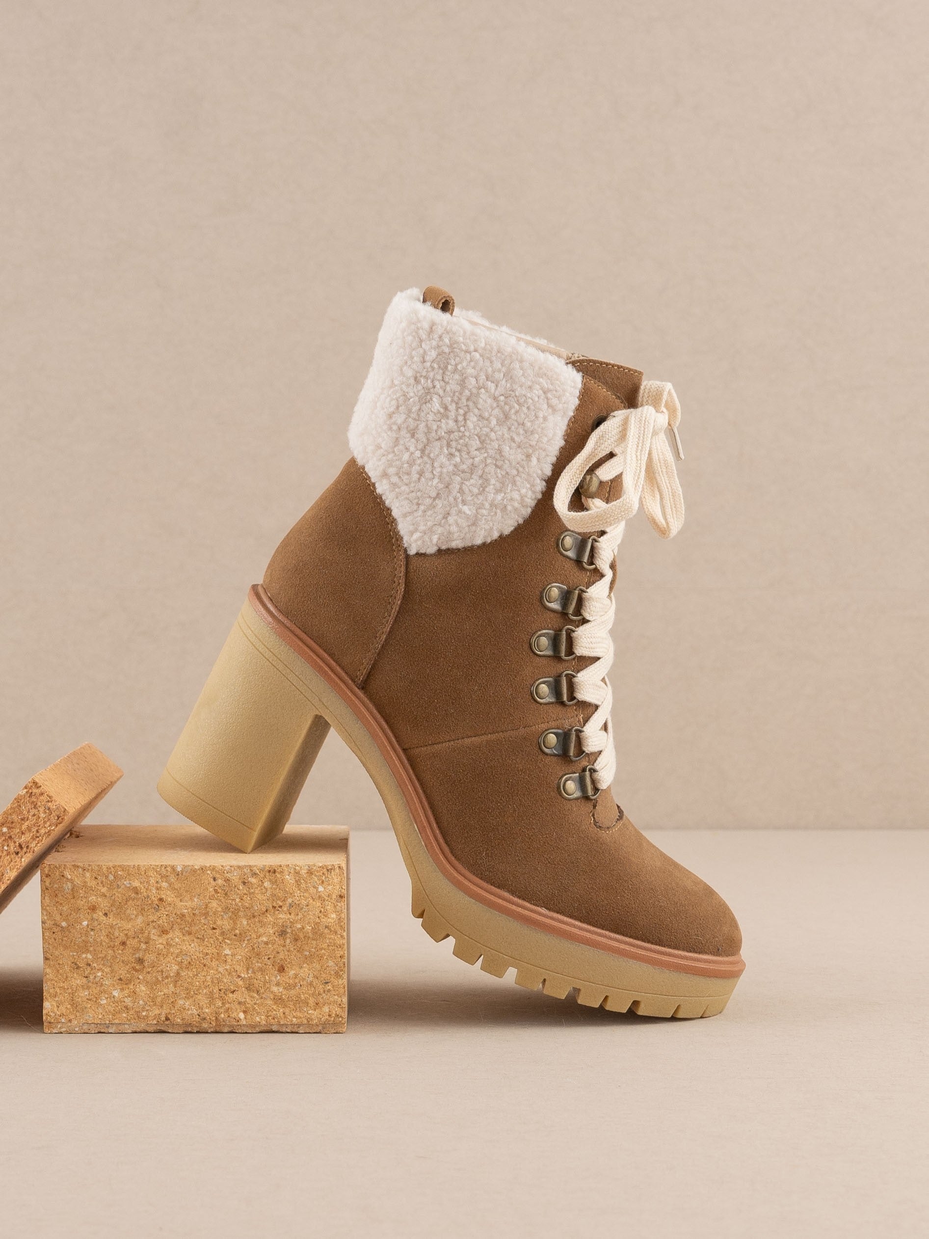 RARA Boutique heeled platform lace-up sherpa boots with chunky soles and cozy faux fur lining, stylish for winter wear.