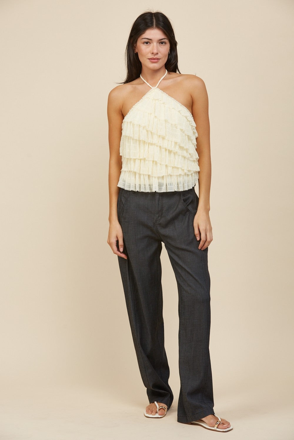 RARA Boutique tiered ruffle halter neck tank top with layered fabric and halter straps, displayed on a hanger.