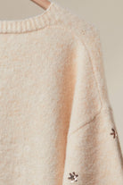 Mello Christmas Tree embroidered soft cardigan with festive holiday design, cozy knit fabric, and button closure.