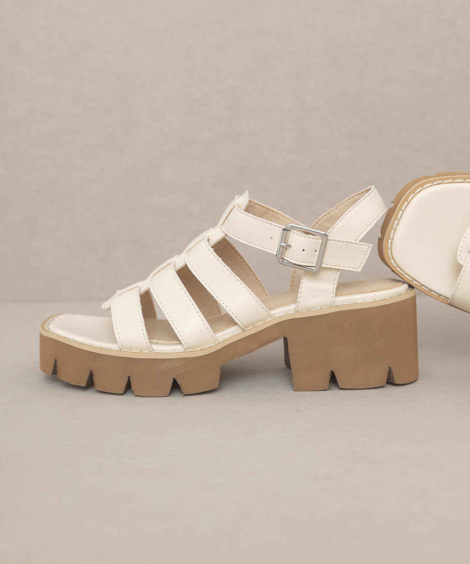 RARA Boutique Lug Sole Heeled Gladiator Sandals with straps and open toe design, featuring a chunky lug sole and ankle buckle.