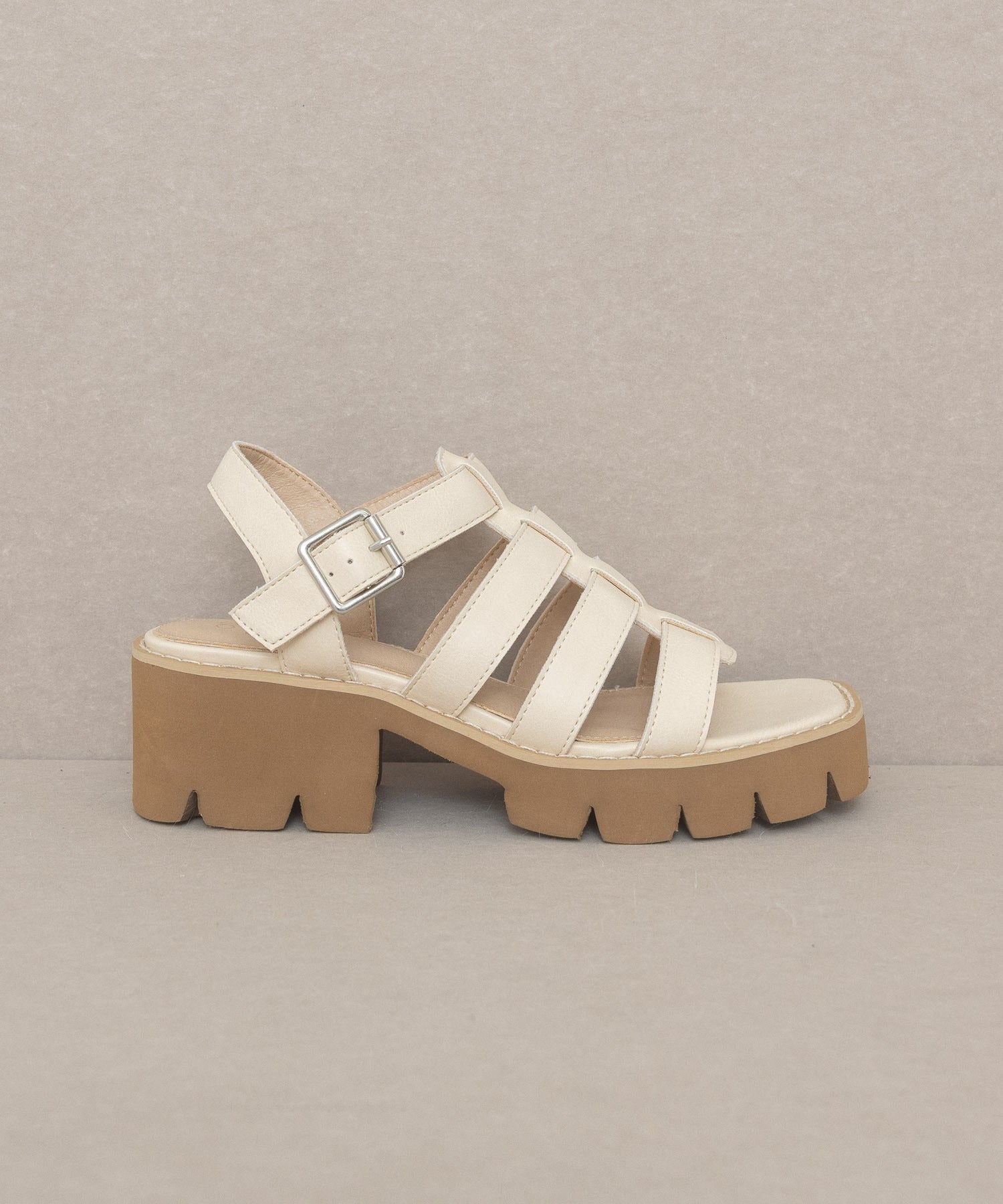 RARA Boutique Lug Sole Heeled Gladiator Sandals with straps and open toe design, featuring a chunky heel and ankle buckle.