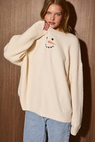 LE LIS embroidered detail sweater top with intricate embroidery on soft knit fabric, showcasing a stylish and cozy sweater.