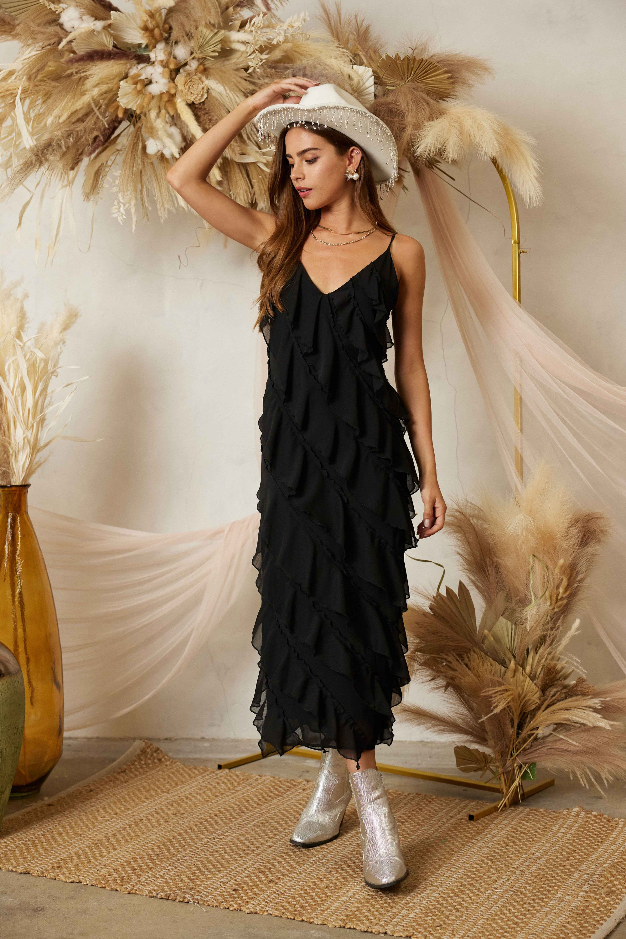 Diagonal tiered ruffle midi dress by RARA Boutique featuring layered fabric and a flowy silhouette.