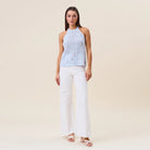 Seashell embellished open-knit halter tank top by RARA Boutique, featuring a stylish design with seashell accents and open knit pattern.