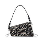 Urban Expressions Fatima zebra shoulder bag with adjustable strap and textured black and white zebra pattern.