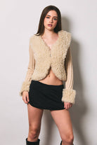 Le Lis long sleeve V-neck fur sweater with ribbed jacket, featuring cozy plush fur and ribbed knit details for warmth and style.
