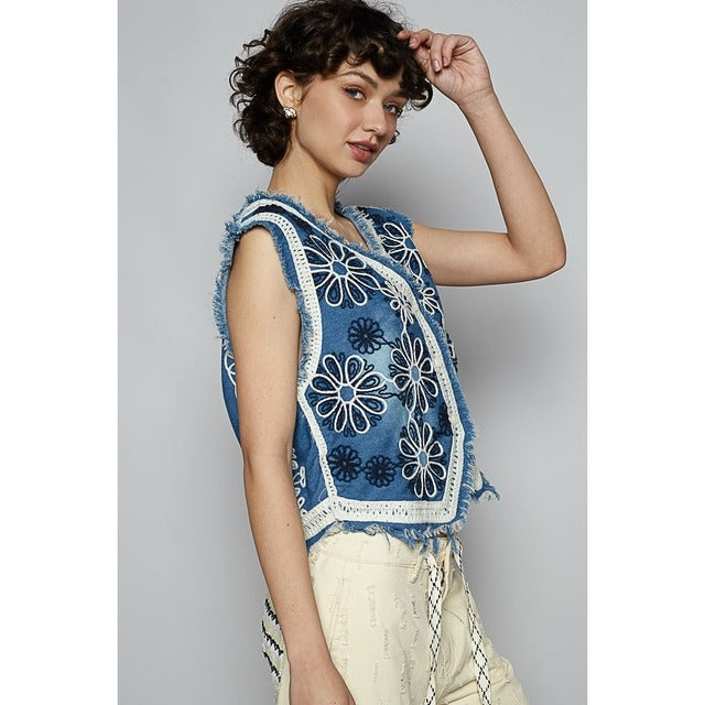 Crochet floral V-neck denim vest by RARA Boutique featuring intricate floral crochet patterns and a stylish V-neck design.