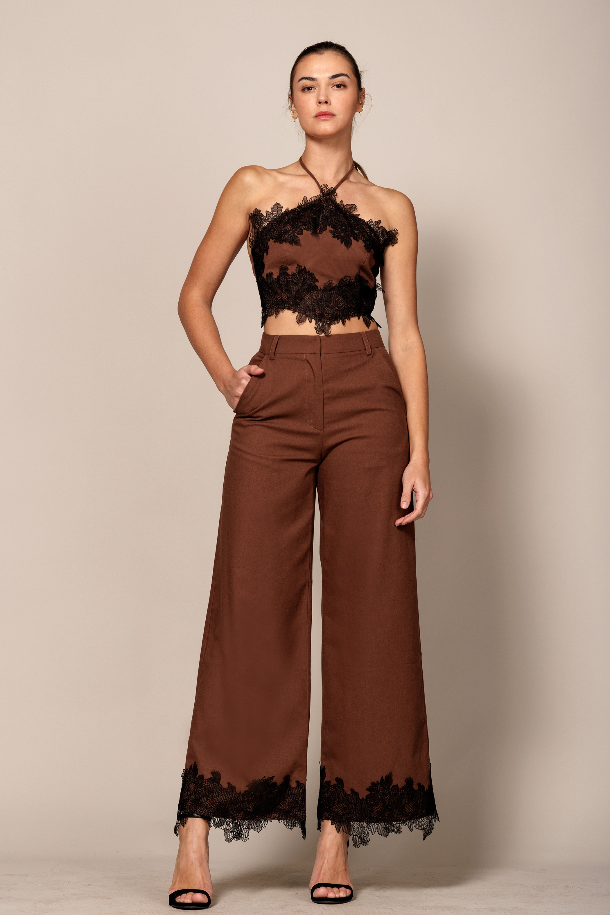 Wide-leg trouser pants with lace trim hem from EB Luxe by RARA Boutique, featuring a flowy fabric and stylish design.