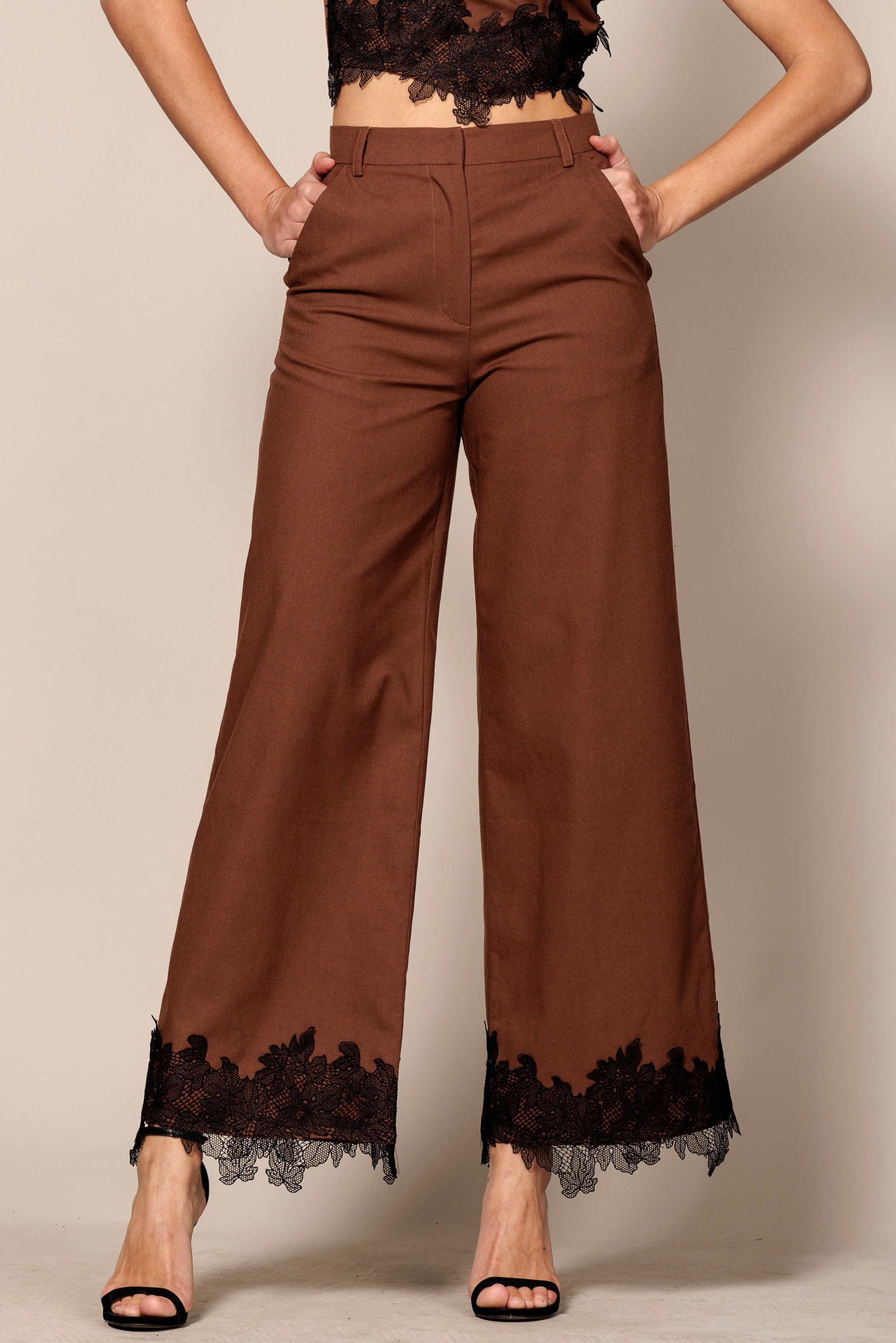 Wide-leg trouser pants with lace trim hem from RARA Boutique's EB Luxe collection, featuring a relaxed fit and stylish design.