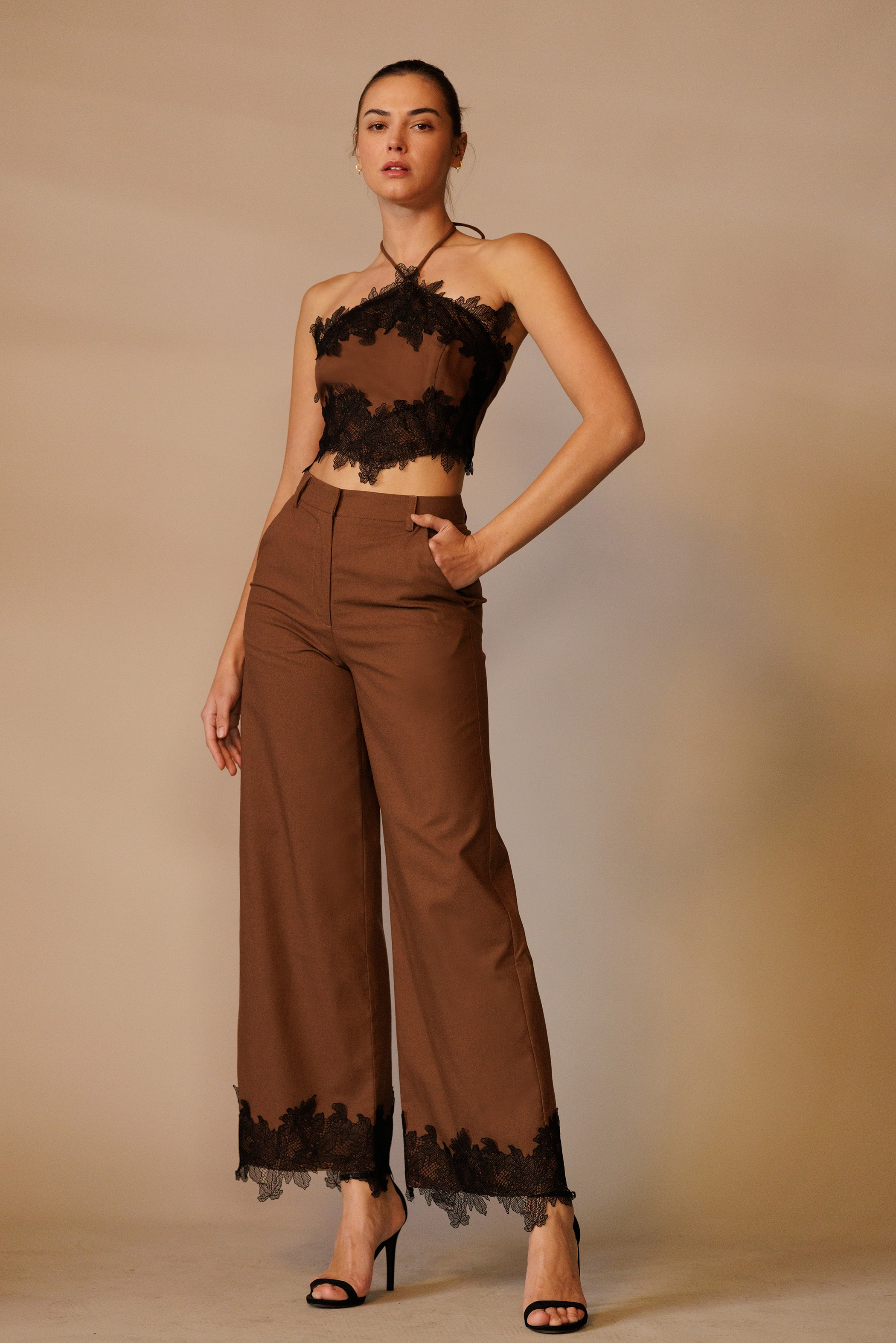 Wide-leg trouser pants with lace trim hem from RARA Boutique, featuring a relaxed fit and elegant design in soft fabric.