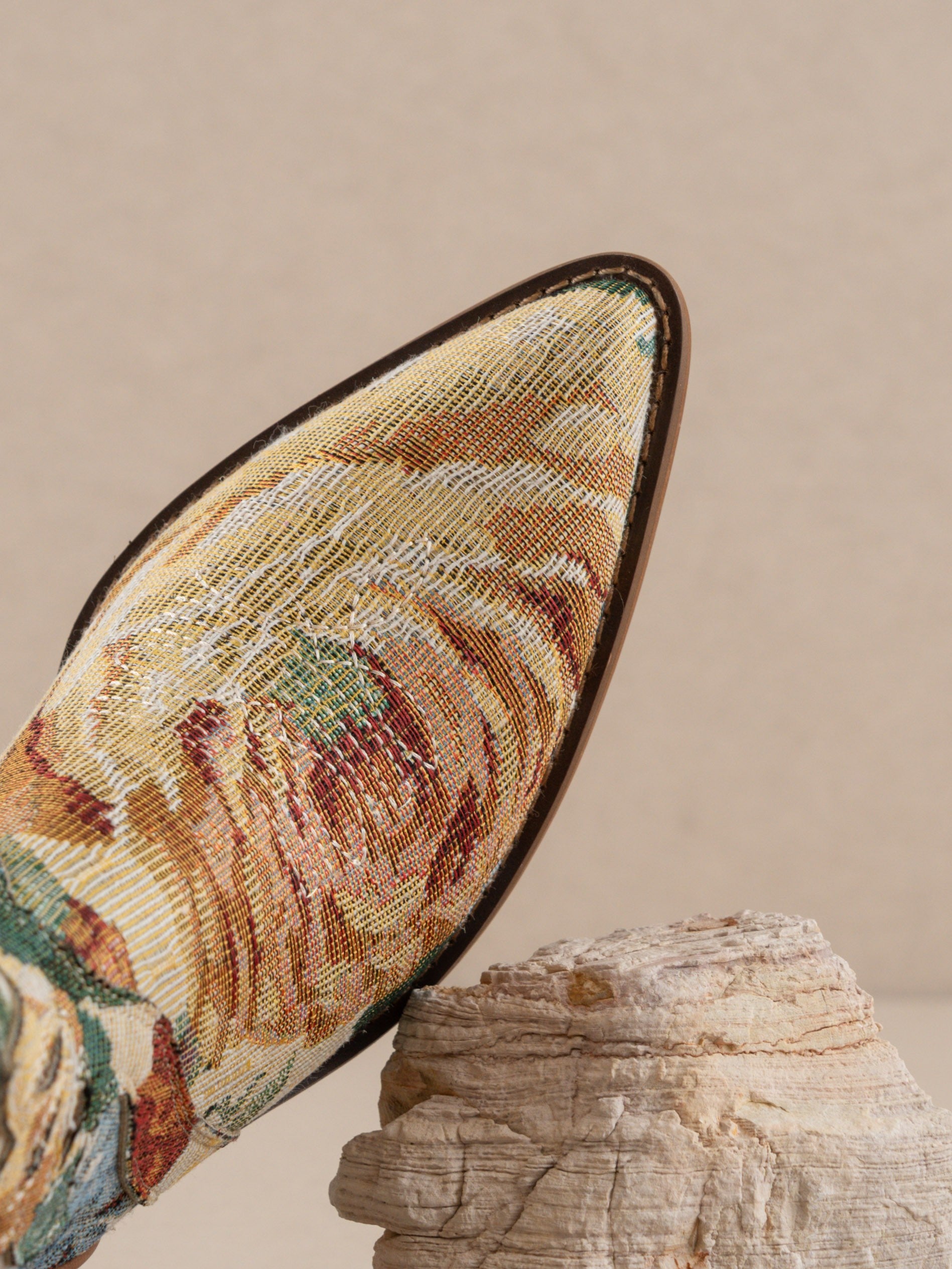 RARA Boutique floral jacquard tapestry western boot with paneled design, intricate floral pattern, and pointed toe.
