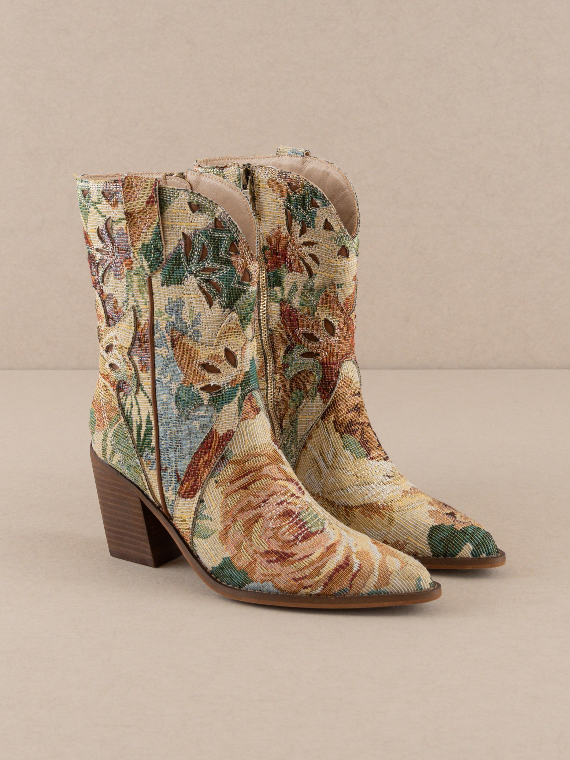 RARA Boutique floral jacquard tapestry western boots with paneled design and intricate floral patterns.