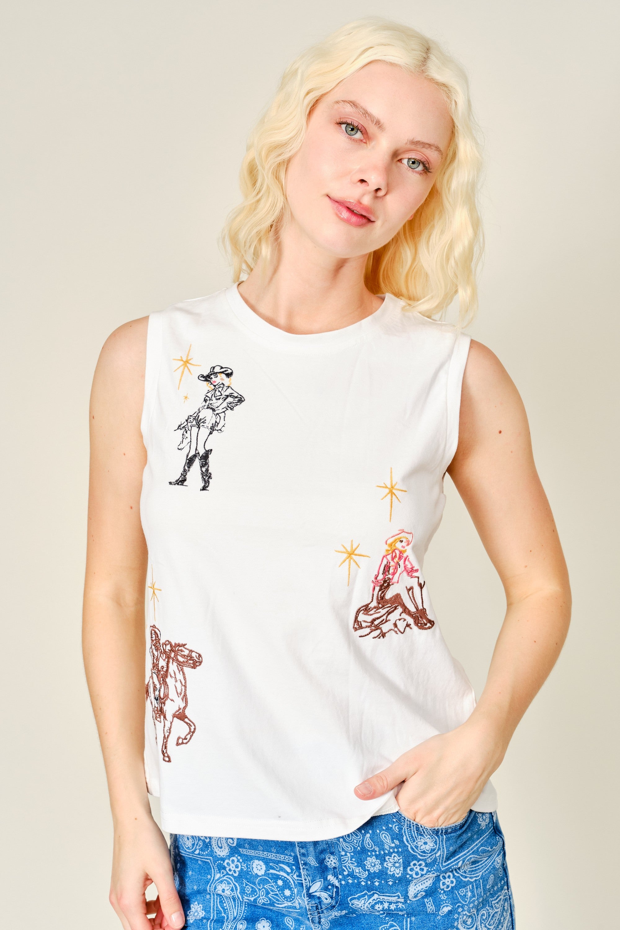 Blue embroidered Western cowgirl tank top by RARA Boutique, featuring intricate western-style embroidery and sleeveless design.