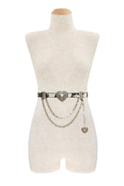 Western cowhide chain belt with engraved heart concho from RARA Boutique, showcasing detailed metal accents and genuine leather.