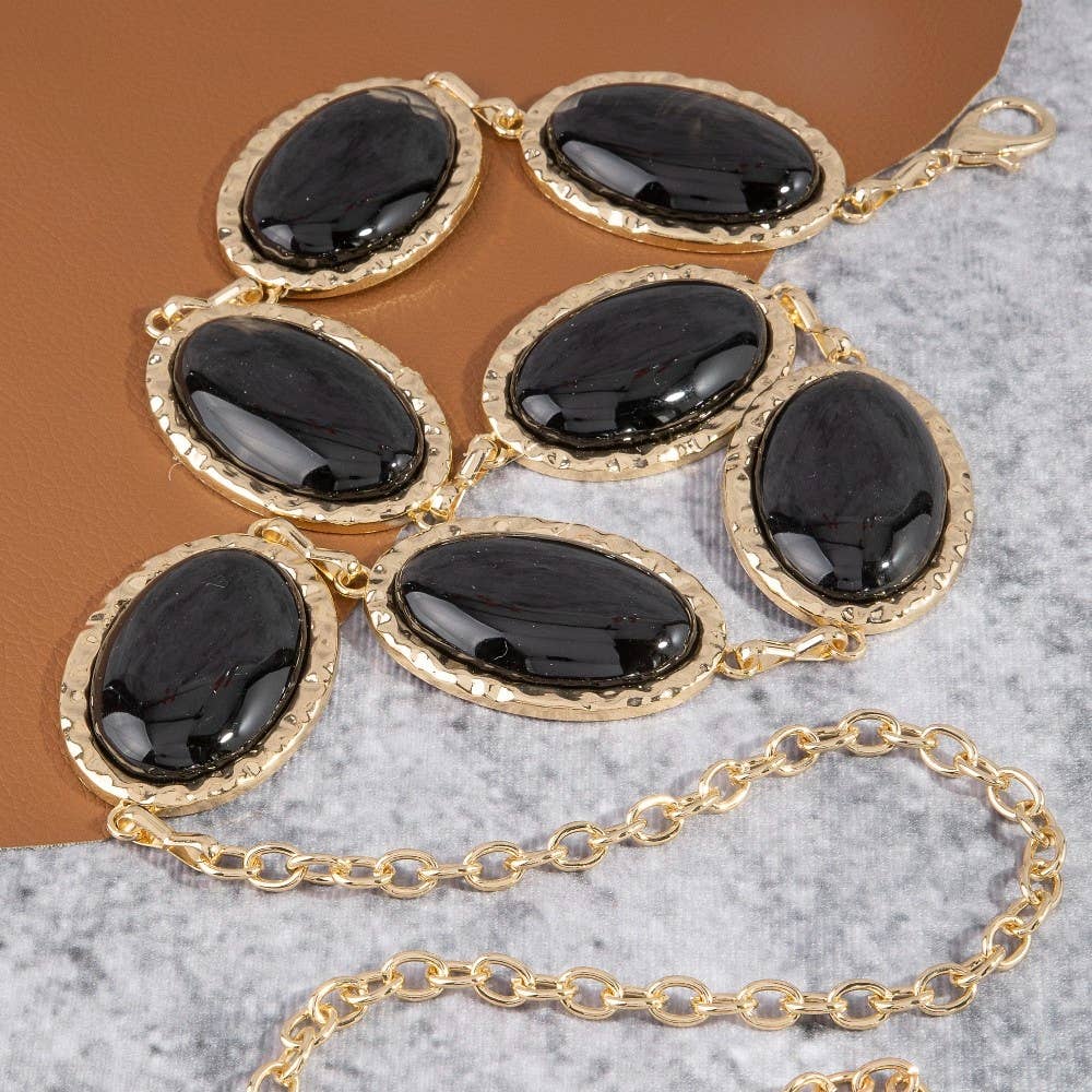 Oval stone gold frame chain belt with elegant design, featuring oval stones and a gold chain for stylish waist accessory.