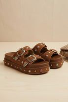 RARA Boutique studded double buckle platform slide sandal with bold design and open toe, perfect for casual summer wear.