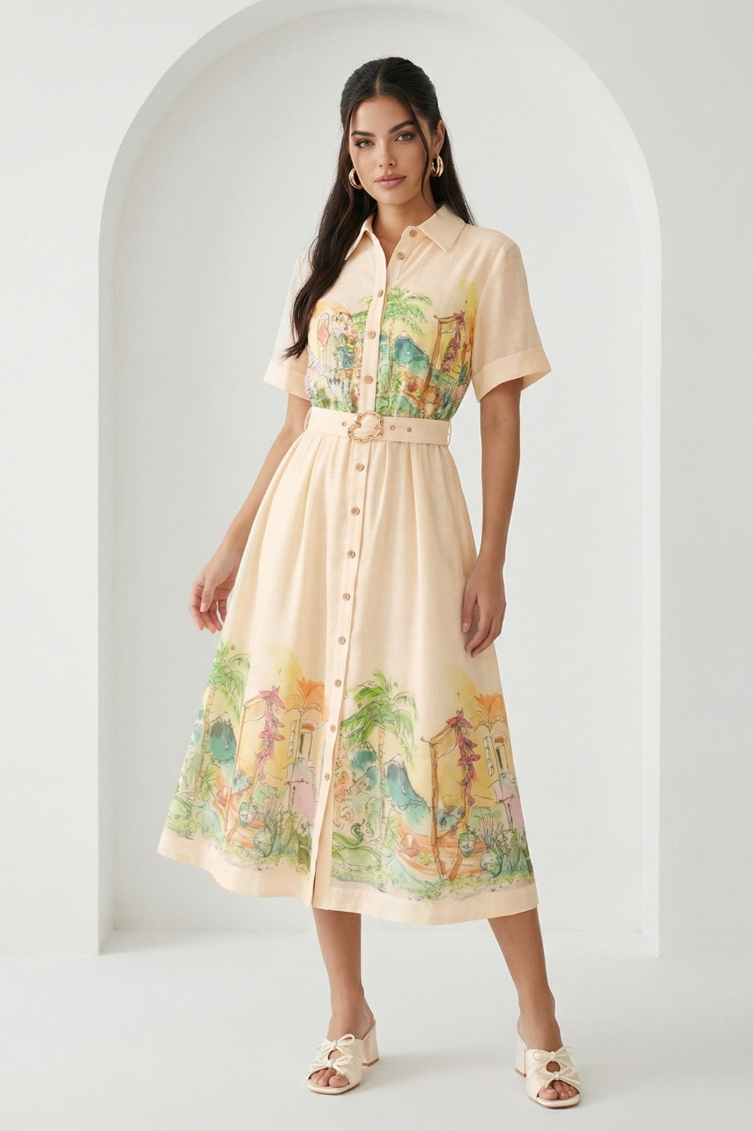 Watercolor village print belted midi dress by RARA Boutique in peach, featuring a flowy silhouette and watercolor landscape design.