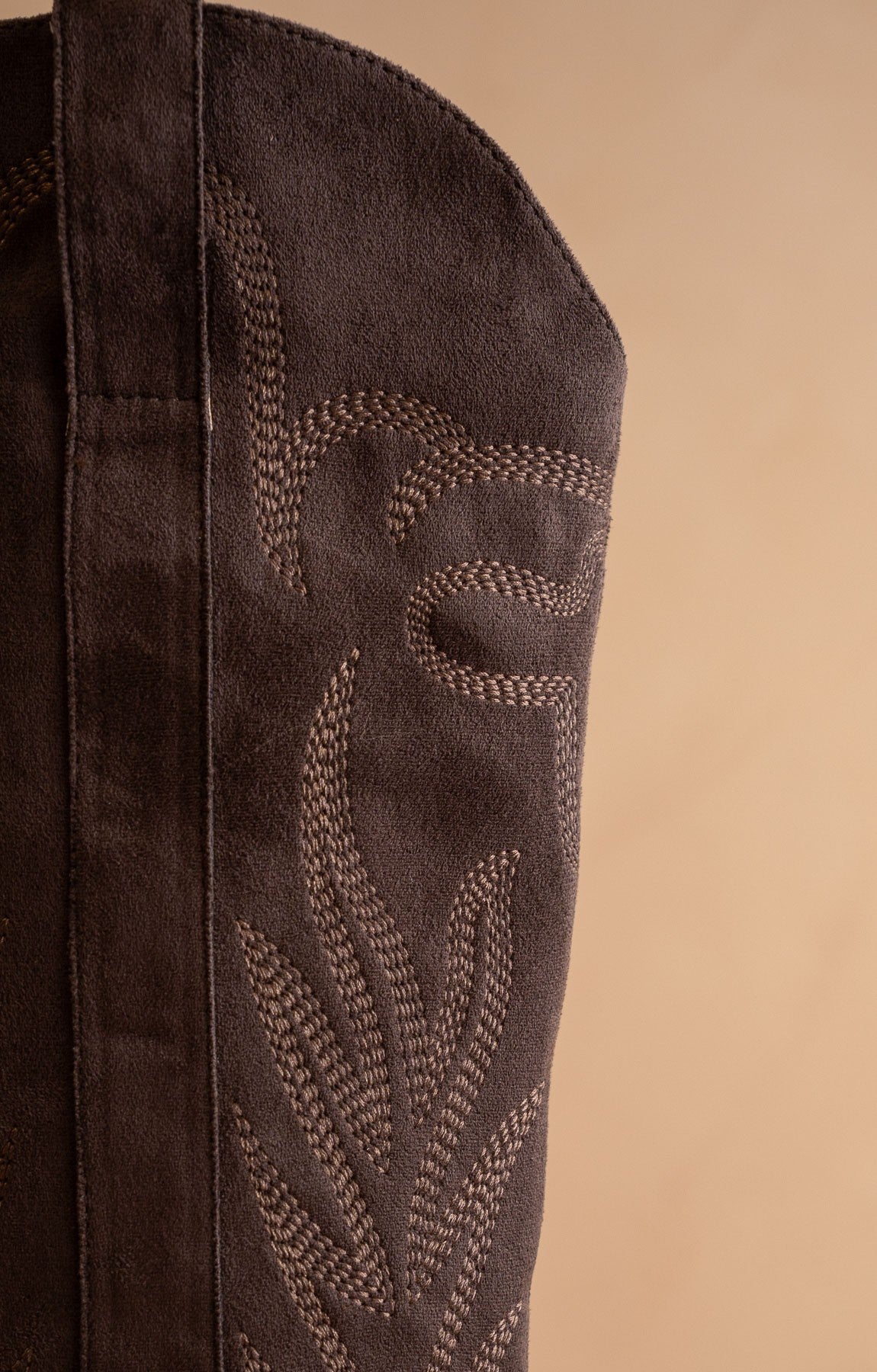 RARA Boutique tall knee-high Western embroidered pointed toe boots with intricate embroidery and sleek leather finish.