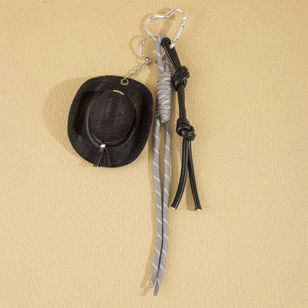 Mini cowboy hat Western rope bag charm from Collections by Fame Accessories attached to a bag with rustic western style.