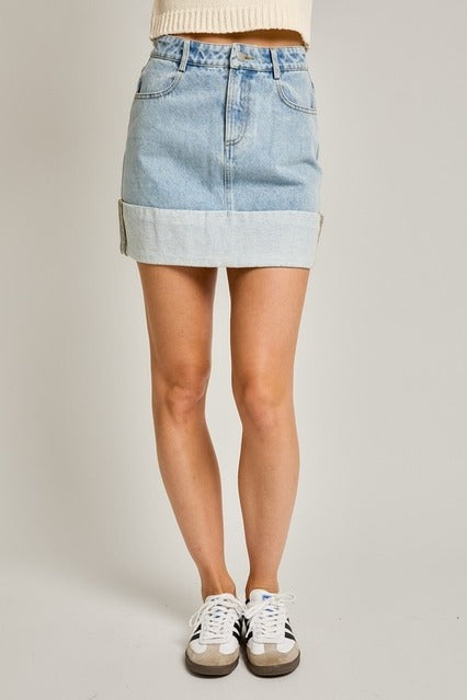 High waisted cuffed hem denim mini skirt by RARA Boutique, featuring a fitted waist and stylish short length.