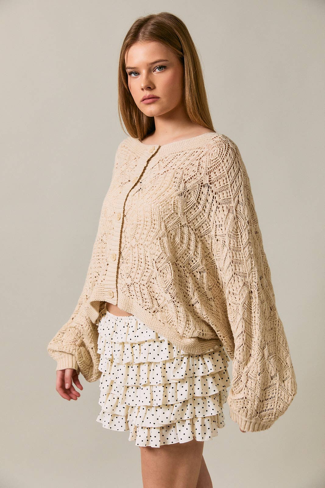 Long sleeve crochet cardigan by LE LIS featuring intricate knit pattern, worn open over a casual outfit.