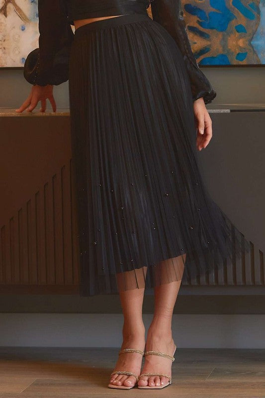 Pearl-embellished pleated mesh midi skirt by RARA Boutique featuring a flowy design and elegant pearl details.