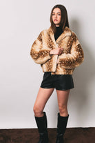 LE LIS faux deer print high neck zip jacket, featuring a stylish high collar and zip closure with a distinctive faux deer pattern.