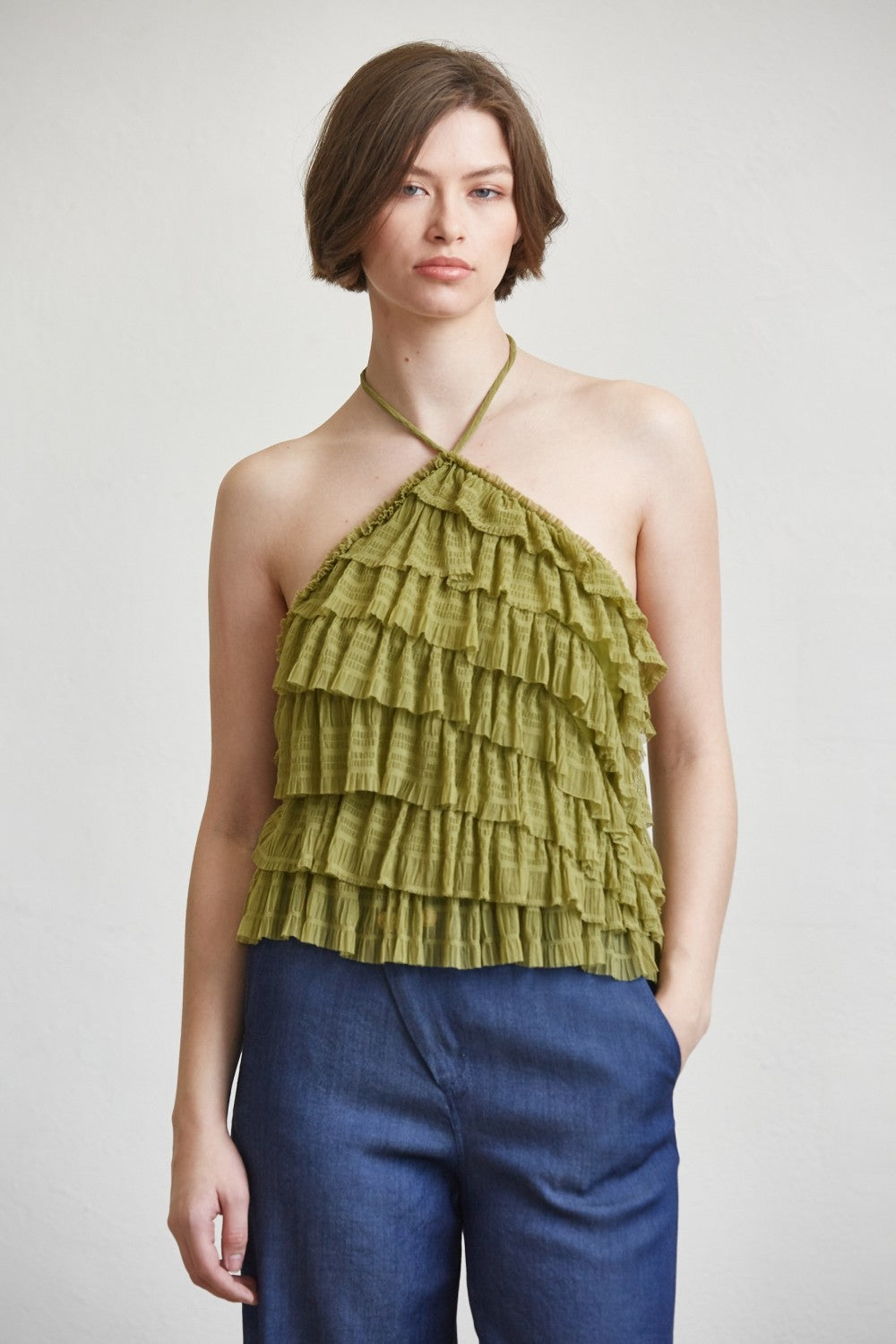 RARA Boutique tiered ruffle halter neck tank top with layered fabric and ruffle details, shown on a white background.
