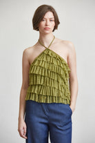RARA Boutique tiered ruffle halter neck tank top with layered fabric and ruffle details, shown on a white background.