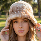 Spotted plush fawn fur bucket hat by Collections by Fame Accessories, featuring a soft, furry, animal print design.