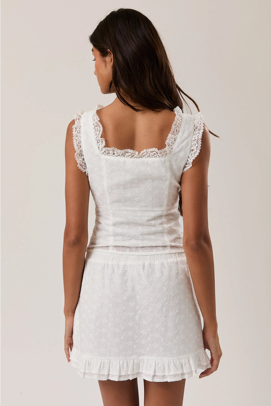 RARA Boutique sleeveless square neck blouse with eyelet lace trim, stylish top featuring a lightweight fabric and feminine design.