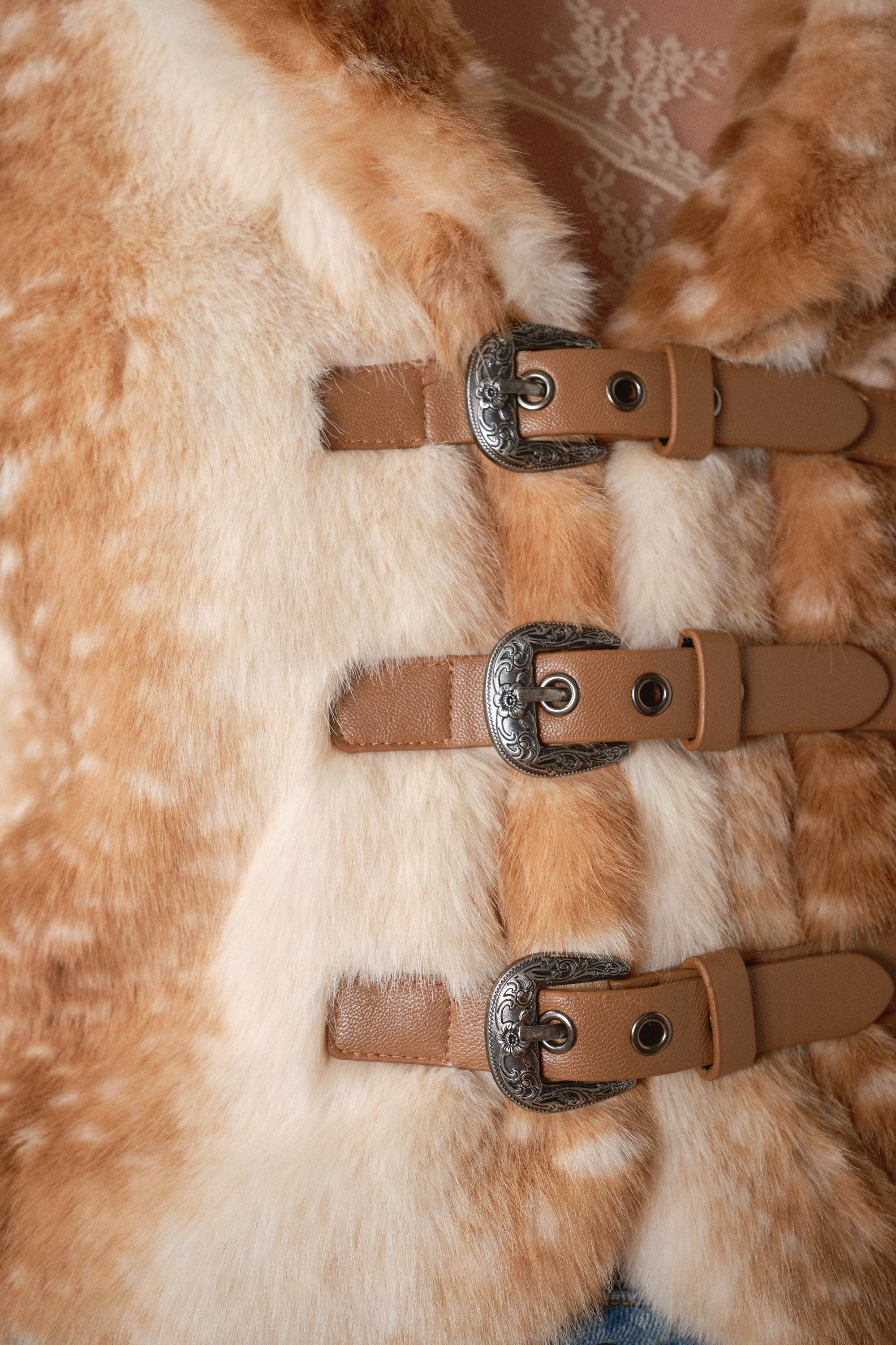 Blue B 25004J Buckled Deer Print Faux Fur Jacket featuring a buckled design and deer print pattern on soft, cozy faux fur.