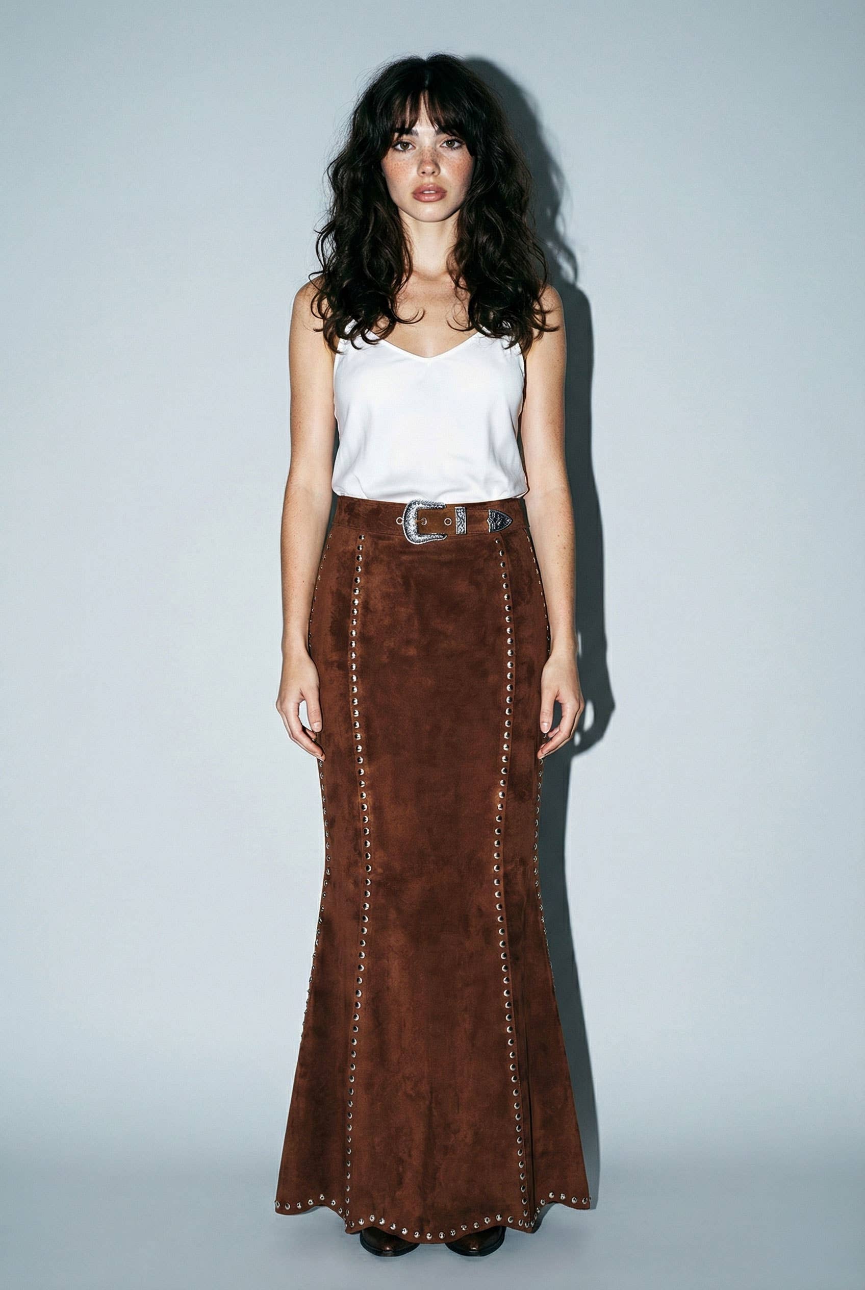 Skylar Rose suede studded maxi skirt with a flowing silhouette and studded details, shown in a natural fabric and stylish design.