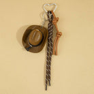 Mini cowboy hat western rope bag charm with gold accents, featuring a rustic cowboy style accessory for bags and keychains.