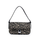 Urban Expressions Tuesday Gloria zebra shoulder bag with black and white striped pattern and adjustable shoulder strap.