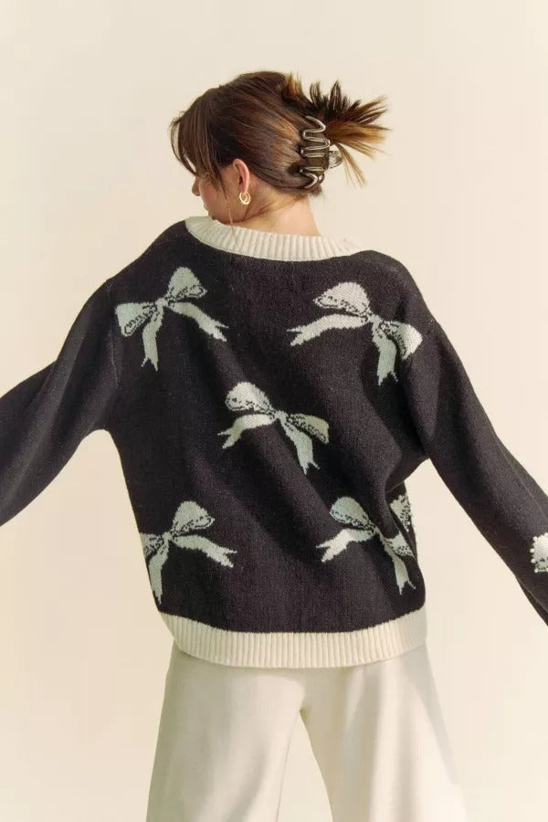 RARA Boutique pearl studded bow balloon sleeve V-neck sweater with ribbed hem and soft knit fabric, stylish and cozy.